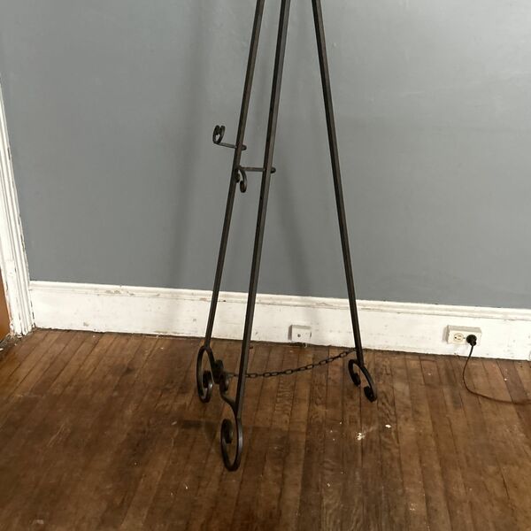 Metal Easel  With Five Adjustable Settings For Picture Or Water Ever You Chose To Use It For . And Can Always Spray Paint It To Your Liking.