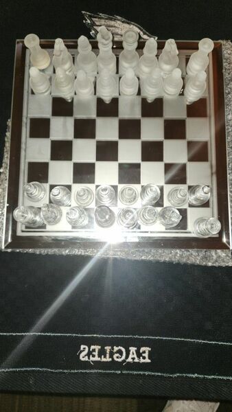 THIS ABSOLUTELY STUNNING POLISHED GLASS CHESS SET.