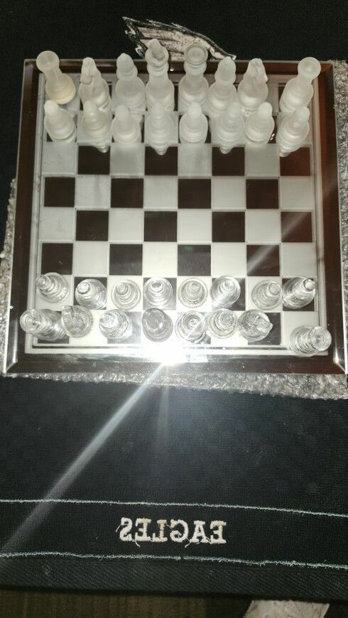 THIS ABSOLUTELY STUNNING POLISHED GLASS CHESS SET.